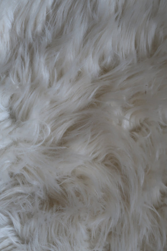 The rug on the floor of my room that I like to lie on.